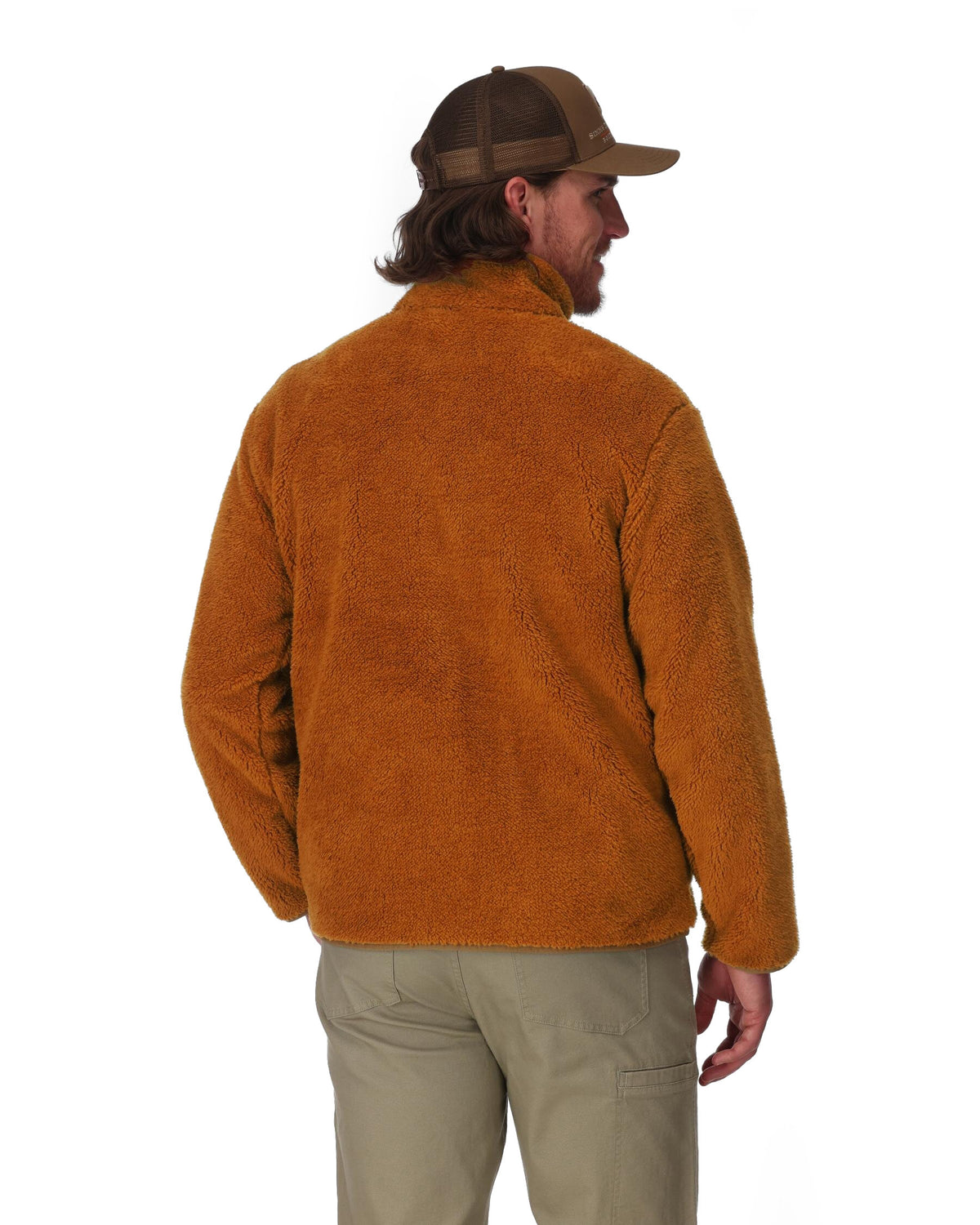 Man wearing a brown fleece jacket and cap on a white background. 