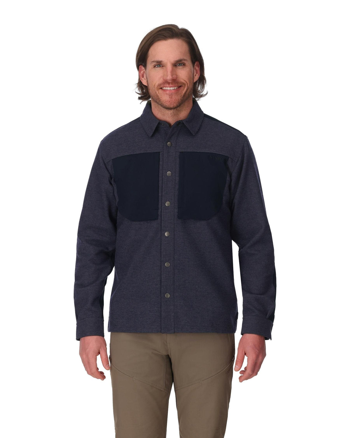 Man wearing a dark blue flannel shirt with black patchwork on a white background
