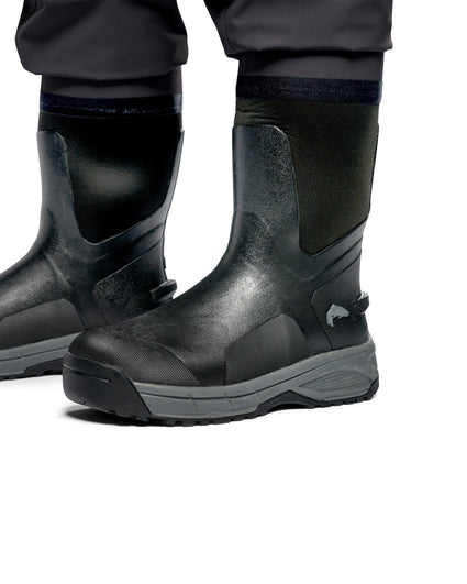 Men's G3 Pro Bootfoot Waders Black safety work boots with dark gray soles, shown on a person's feet with dark pants against a white background.